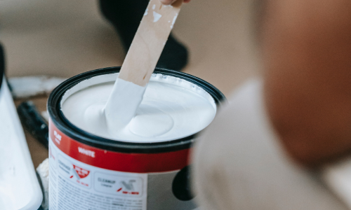 Stirring paint can with wood stick